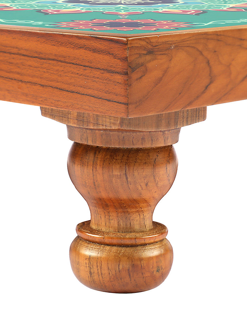 Elevate your sacred space with the Bajot Aquamarine Mandala, skillfully crafted from Teak Wood and adorned with Serenity Mandala Art. Recognized as Chowki or Pattla, this versatile piece adds a touch of serenity to your decor, pooja, and spiritual ambiance, providing a divine platform for placing god idols.