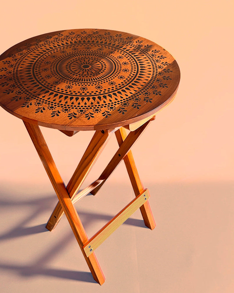 Elevate your space with the Blooming Teak Round Folding Table, a versatile piece made from 100% Teak Wood featuring exquisite Mandala Art. Use it as a coffee table, sofa side table, bed side table, or balcony accent, and enjoy easy cleaning and maintenance.