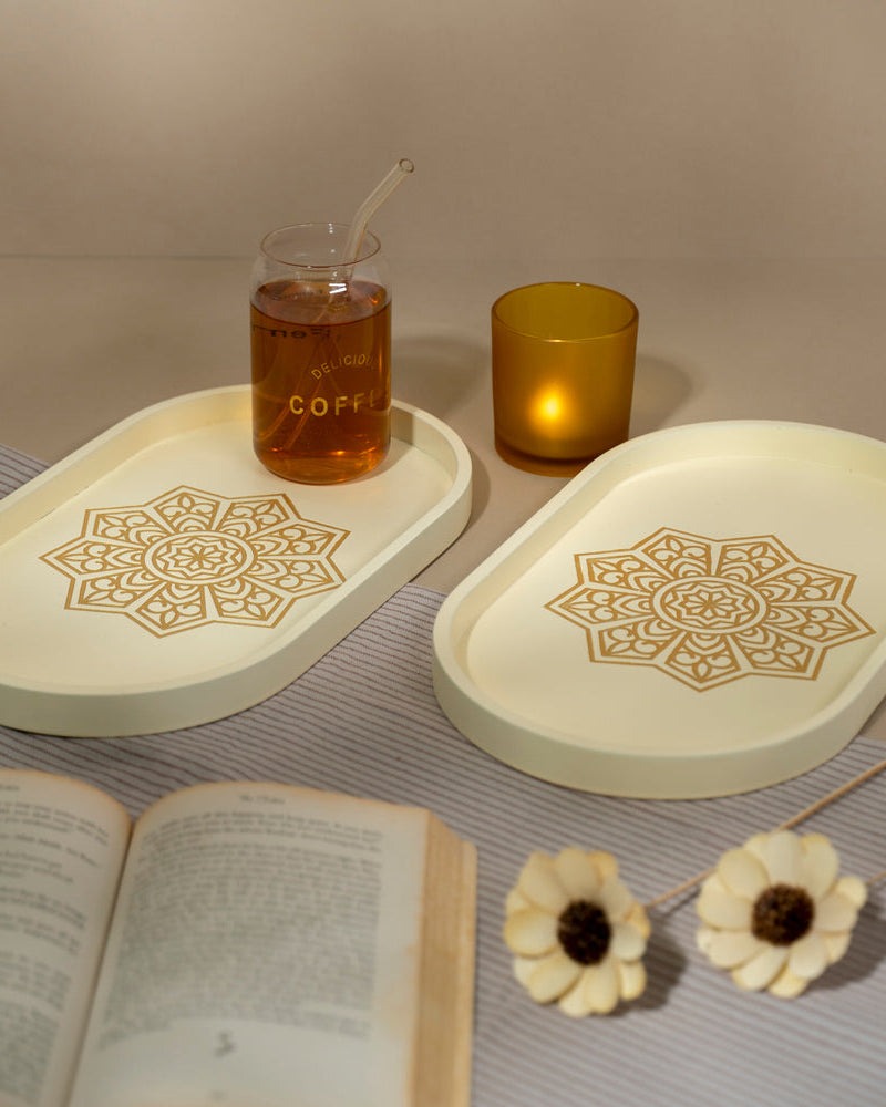 Elevate your serving experience with the Ivory White Oval Tray, a light-weight marvel crafted from Premium Painted Wood. Sized at 13" x 7.5" x 0.75"H, this versatile tray, adorned with Serenity Mandala Art, seamlessly combines functionality with art for serving, organizing, and decor.