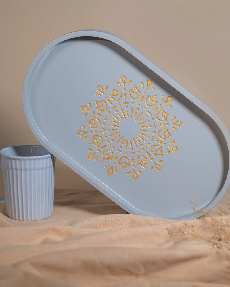 Immerse yourself in style with the Pebble Grey Oval Tray (medium), a light-weight wonder crafted from Premium Painted Wood. This versatile tray, adorned with captivating Serenity Mandal Art, effortlessly combines practicality and elegance, perfect for serving, organizing, and enhancing your decor.
