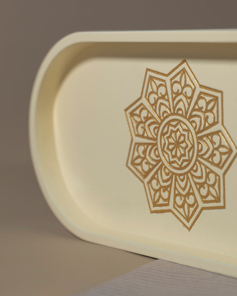 Experience the art of organization with our Ivory White Oval Tray, crafted from Premium Painted Wood. This light-weight tray, adorned with Serenity Mandala Art, serves as a stylish solution for serving and organizing, adding a touch of decor to any space.