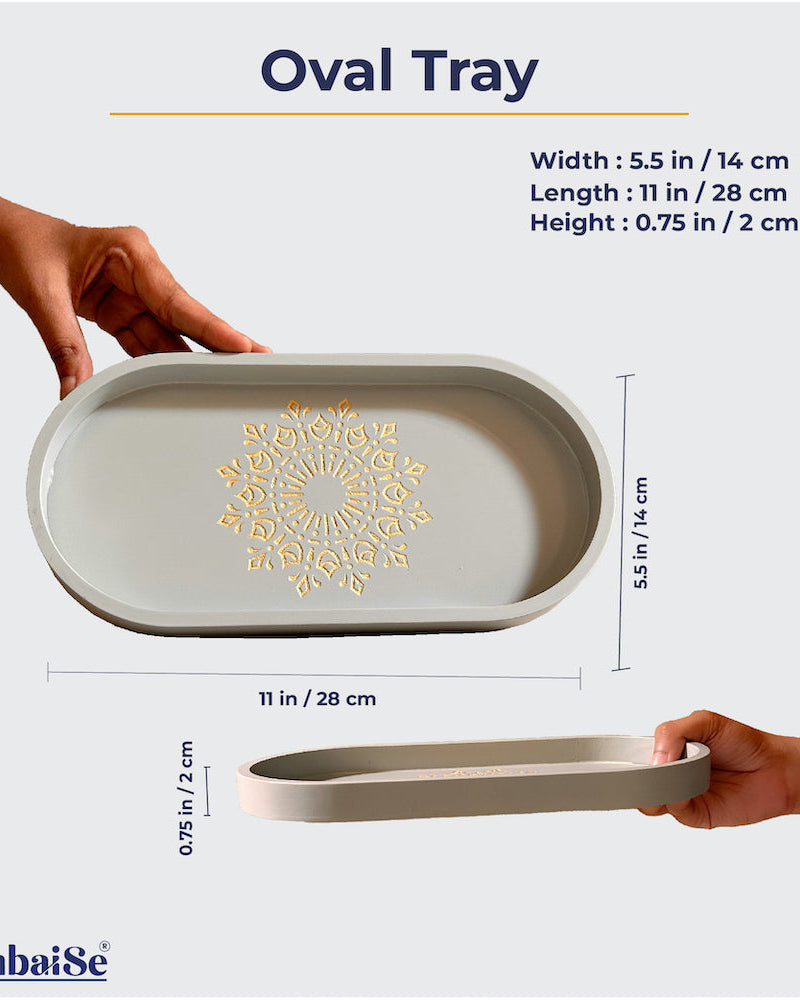 Introducing the Pebble Grey Oval Tray ‰ÛÒ a stylish and functional addition to your home. Crafted from Premium Painted Wood, this light-weight 11‰Û x 5.5‰Û tray, featuring Serenity Mandala Art, is perfect for serving, organizing, and enhancing your decor.