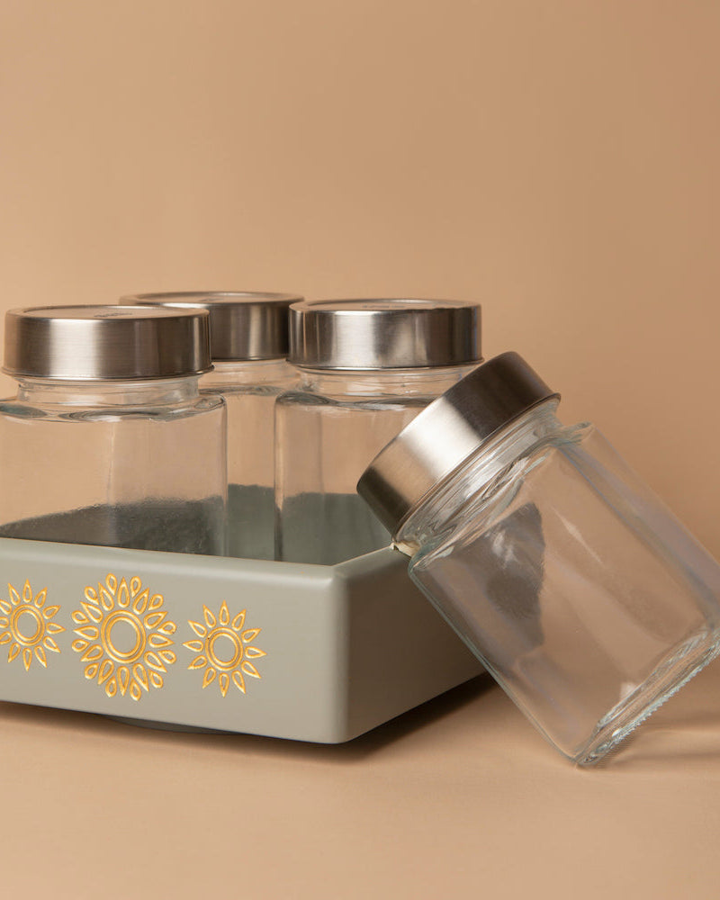 Embrace order amid chaos with our Grey Revolving Jar Tray Organizer, crafted from Premium Painted Wood. Efficiently organize four jars as it rotates 360 degrees, bringing functionality and style to your kitchen, living room, or dining table. Adorned with Serenity Mandala Art, it's a blend of practicality and elegance.