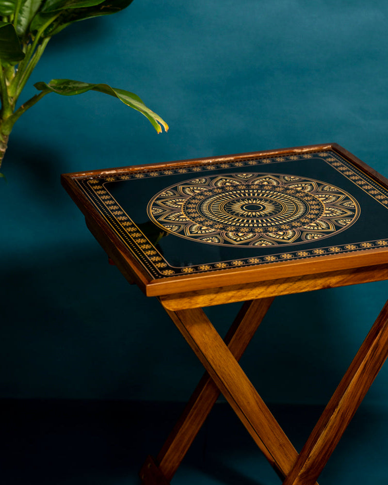 Experience serenity in style with our Gold and Black Square Folding Table. Crafted from teak wood and adorned with Mandala Art, this versatile piece serves as a coffee table, sofa side table, bed side table, or balcony accent. Easily foldable for convenience, it's designed for easy cleaning and maintenance.