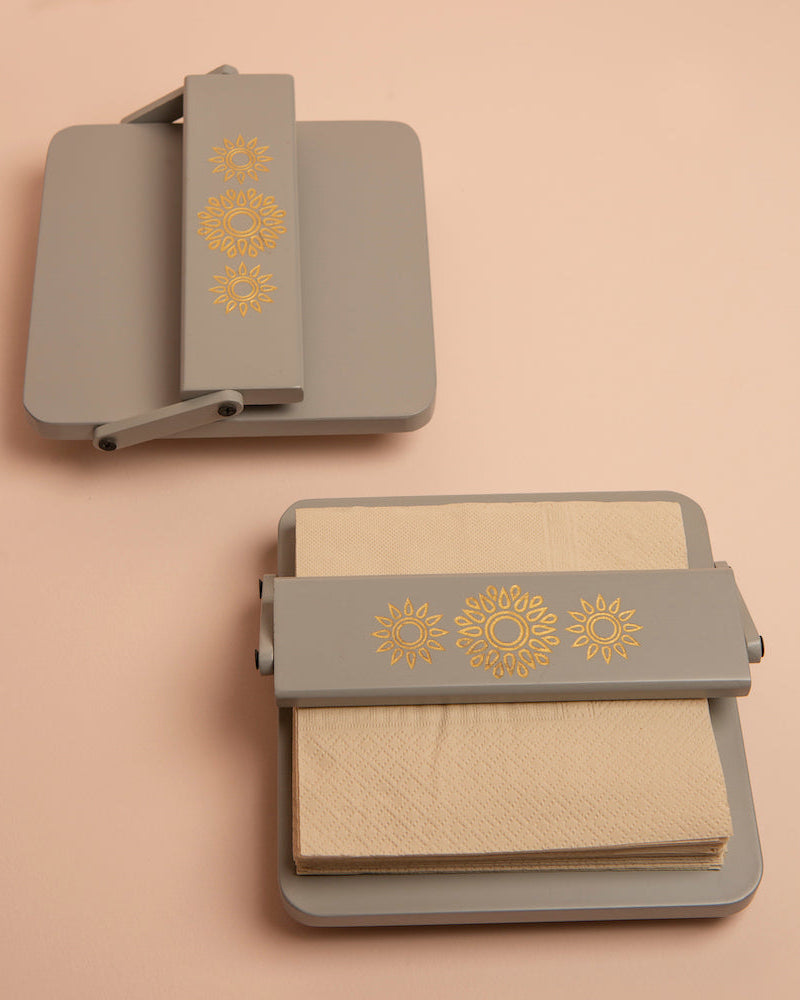 Immerse your space in elegance with the Pebble Grey Tissue Tray, a high-quality wooden organizer adorned with Serenity Mandal Art. The adjustable flap ensures square tissues stay put, offering a stylish and practical solution to maintain order in the chaos of daily life.