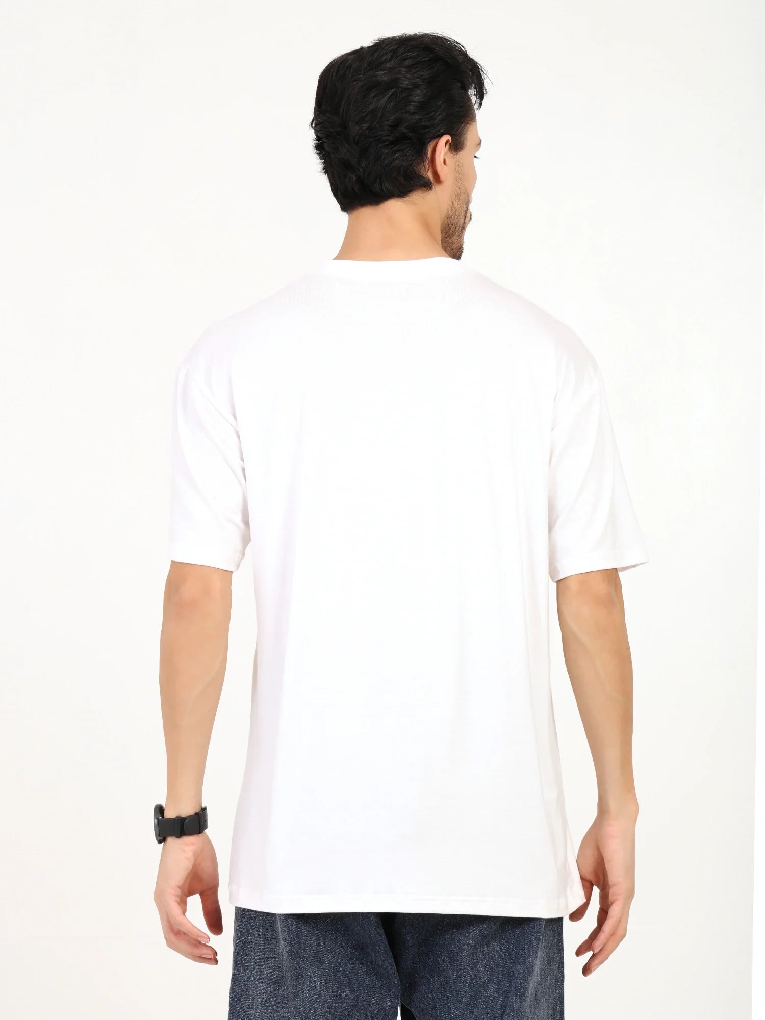 Back view of a man wearing an oversized bamboo T-shirt, showcasing its loose fit and soft fabric.