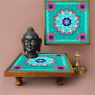 Immerse your space in the aura of the Bajot Aquamarine Mandala, a Teak Wood marvel designed for decor, pooja, and spiritual ambiance. Known as Chowki or Pattla in various cultures, this piece, adorned with Serenity Mandala Art, creates a serene haven for placing god idols.