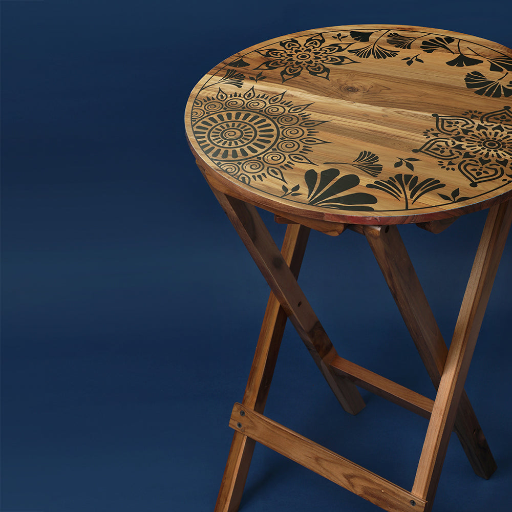 Experience versatility and elegance with our Dream Plantation Round Folding Table. Crafted from 100% Teak Wood, this multifunctional piece adds charm as a coffee table, sofa side table, bed side table, or balcony centerpiece, offering easy cleaning and maintenance.