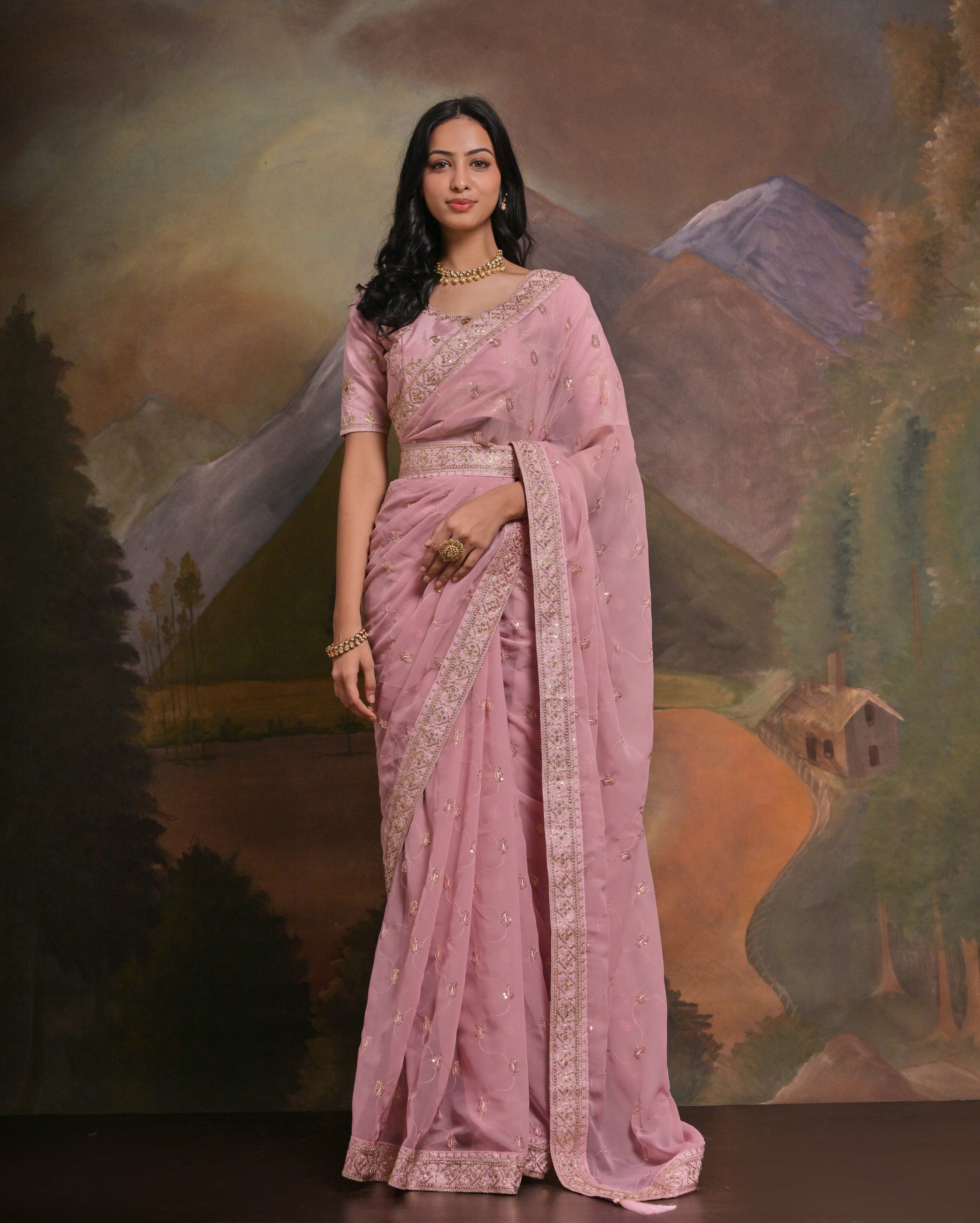 HEER: Old rose georgette hand embroidered saree