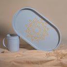 Immerse yourself in style with the Pebble Grey Oval Tray (medium), a light-weight wonder crafted from Premium Painted Wood. This versatile tray, adorned with captivating Serenity Mandal Art, effortlessly combines practicality and elegance, perfect for serving, organizing, and enhancing your decor.