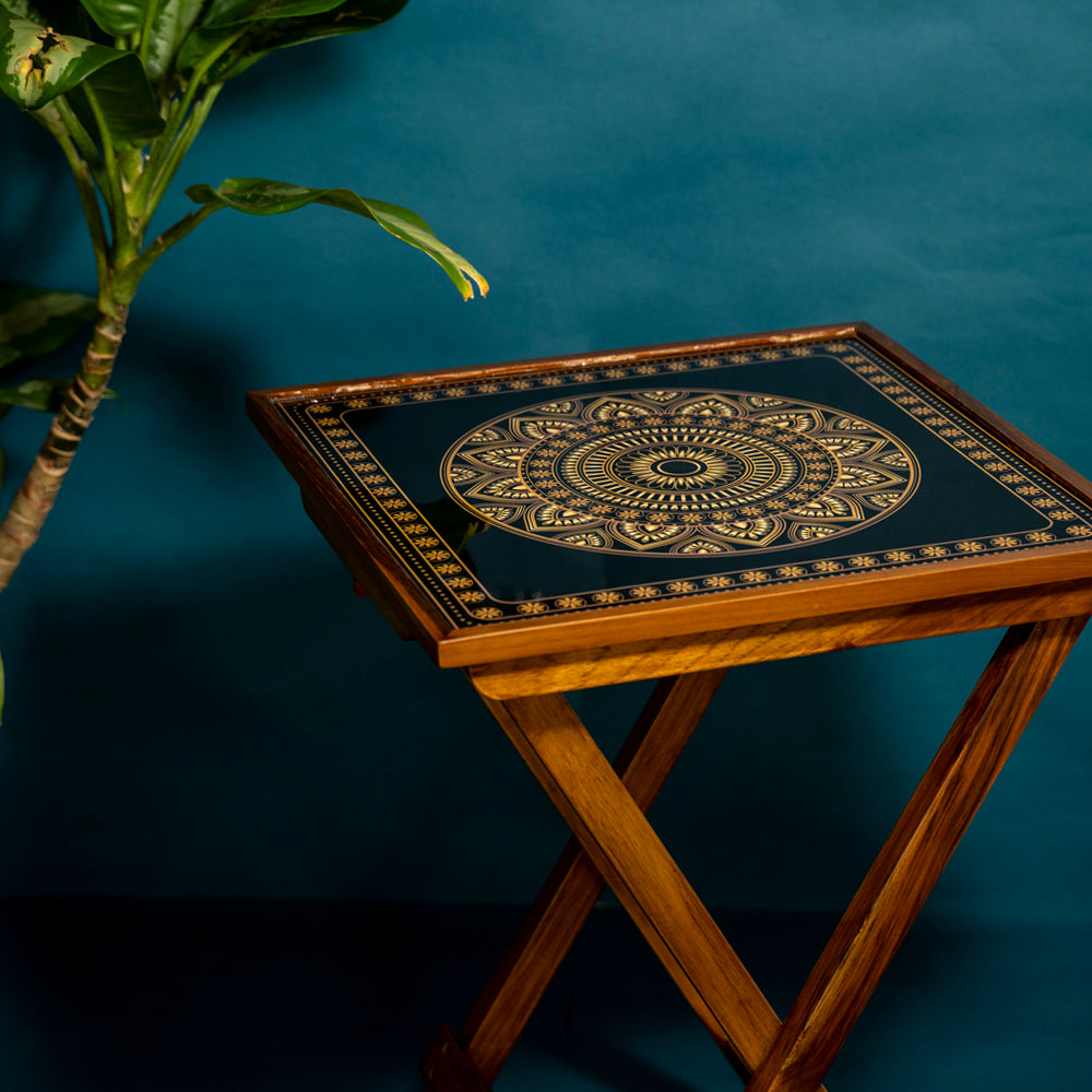 Experience serenity in style with our Gold and Black Square Folding Table. Crafted from teak wood and adorned with Mandala Art, this versatile piece serves as a coffee table, sofa side table, bed side table, or balcony accent. Easily foldable for convenience, it's designed for easy cleaning and maintenance.
